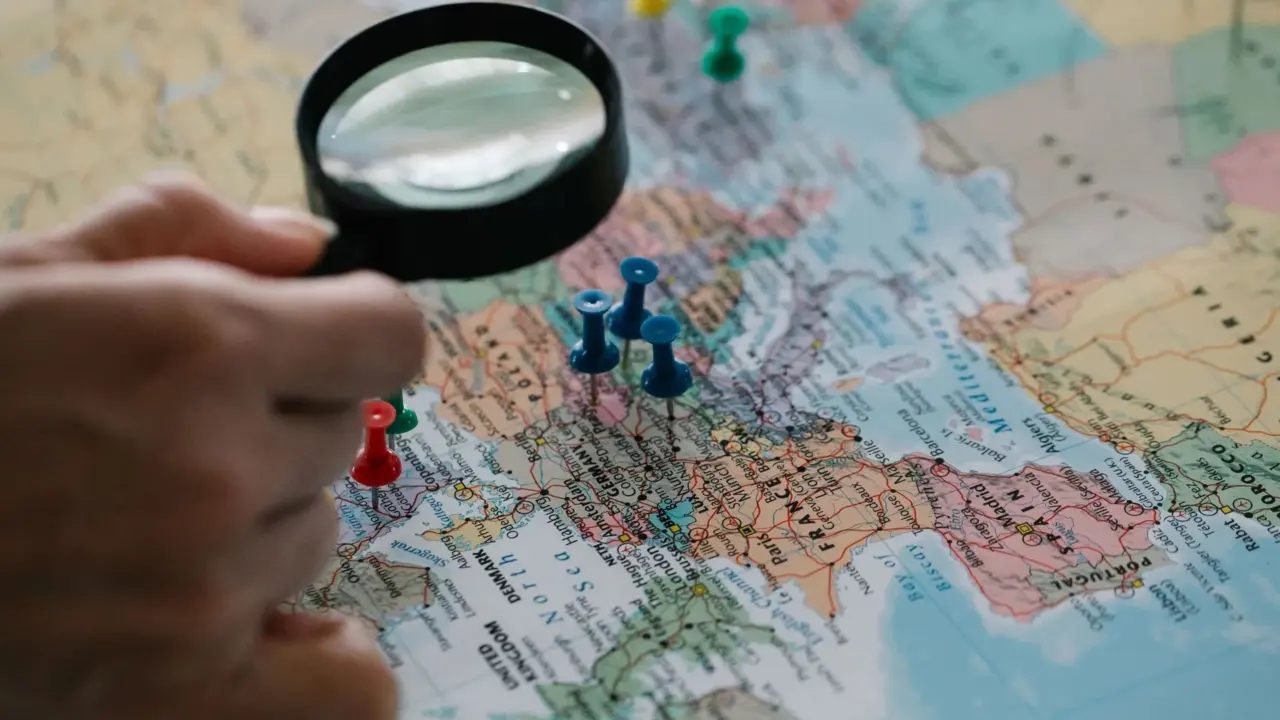 A paper travel map with pins and notes for trip planning